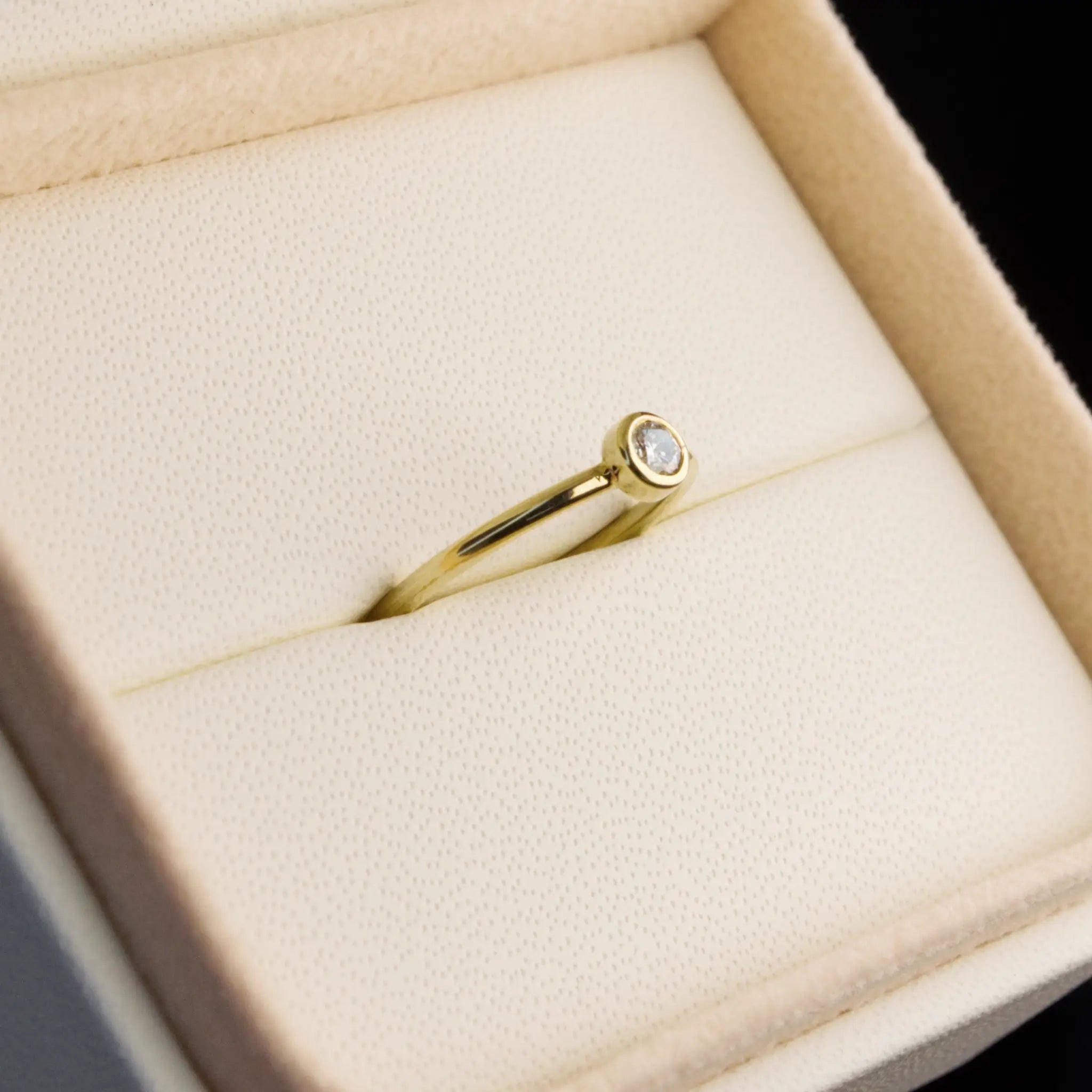 Dainty natural Diamond Bezel set ring in Yellow gold