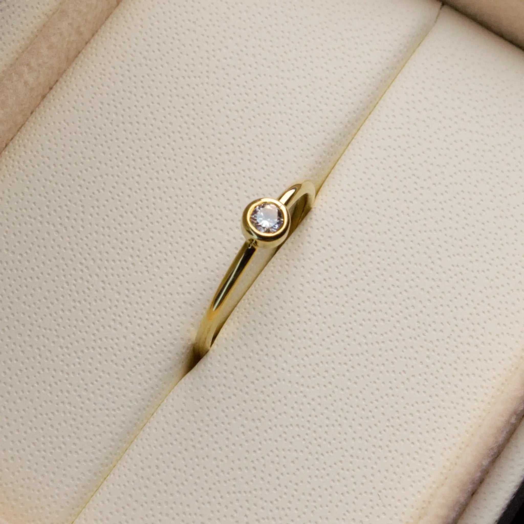 Dainty natural Diamond Bezel set ring in Yellow gold