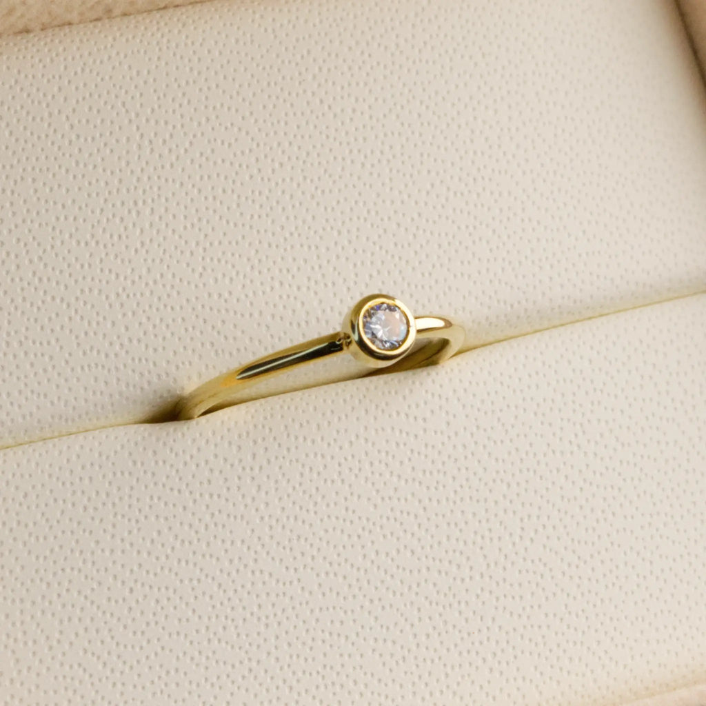 Dainty natural Diamond Bezel set ring in Yellow gold