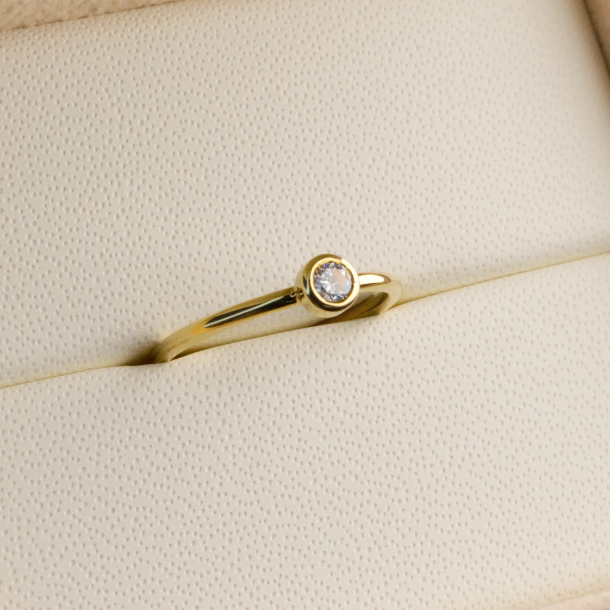 Dainty natural Diamond Bezel set ring in Yellow gold