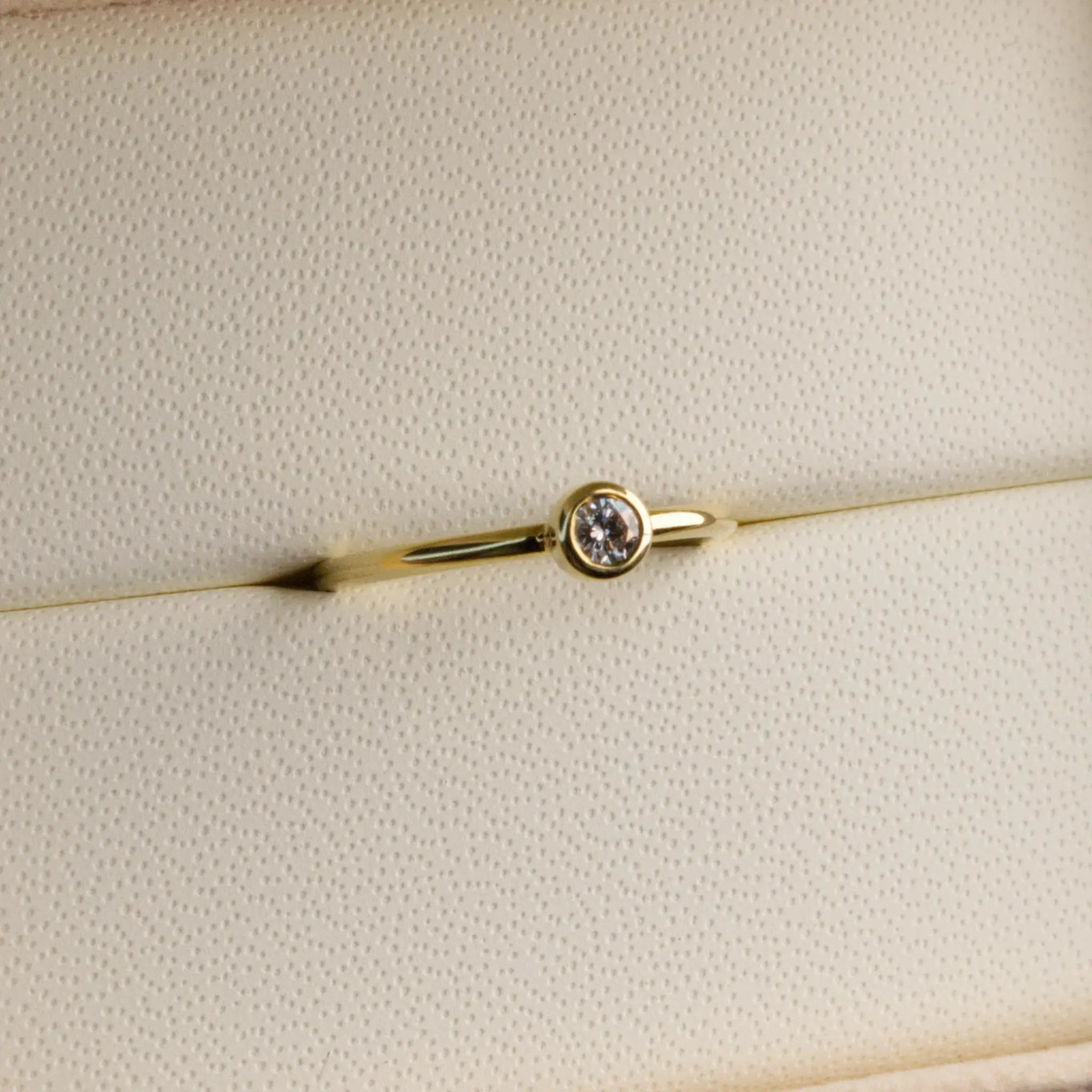 Dainty natural Diamond Bezel set ring in Yellow gold