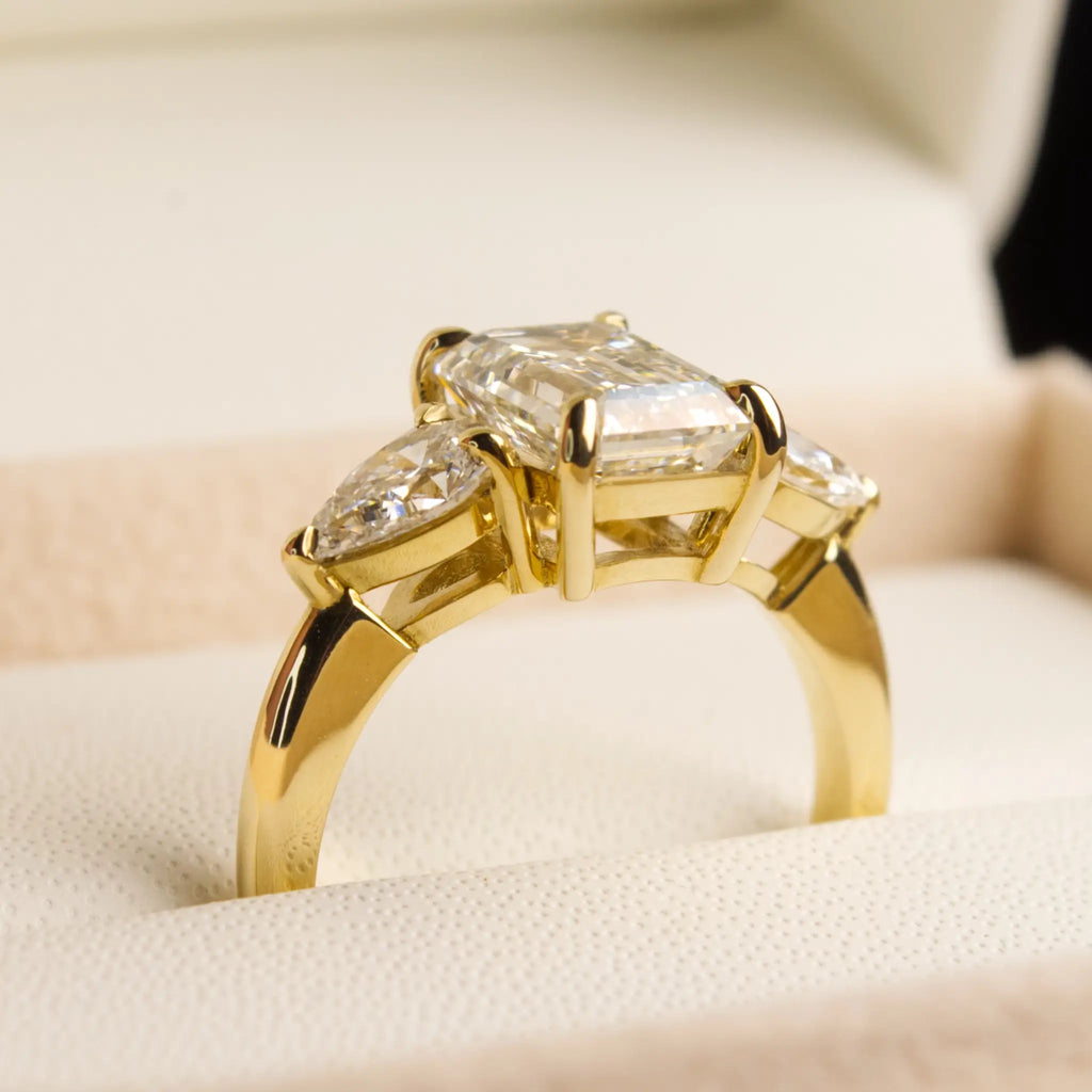 3ct Emerald cut diamond ring with Pear Diamonds