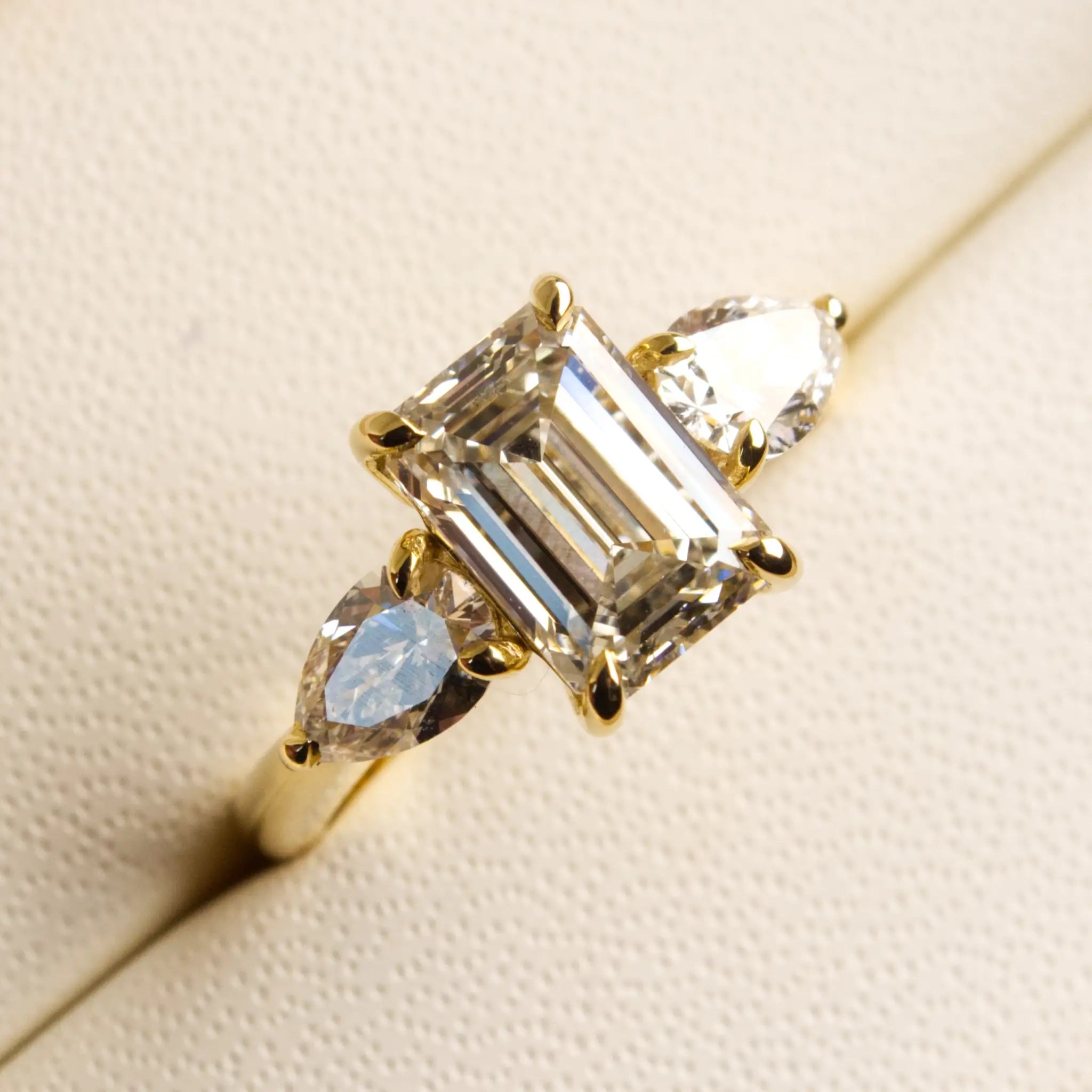 3ct Emerald cut diamond ring with Pear Diamonds