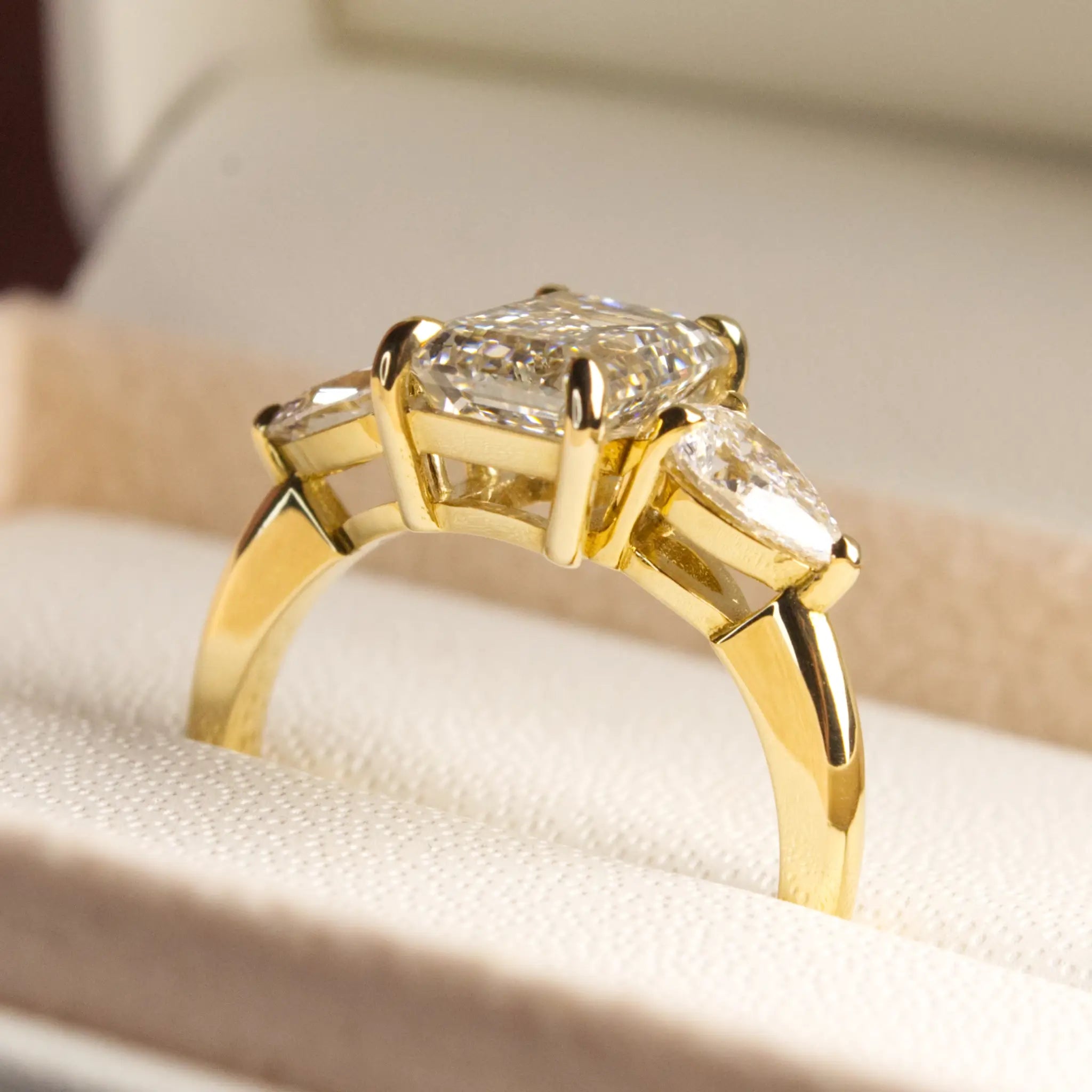 3ct Emerald cut diamond ring with Pear Diamonds