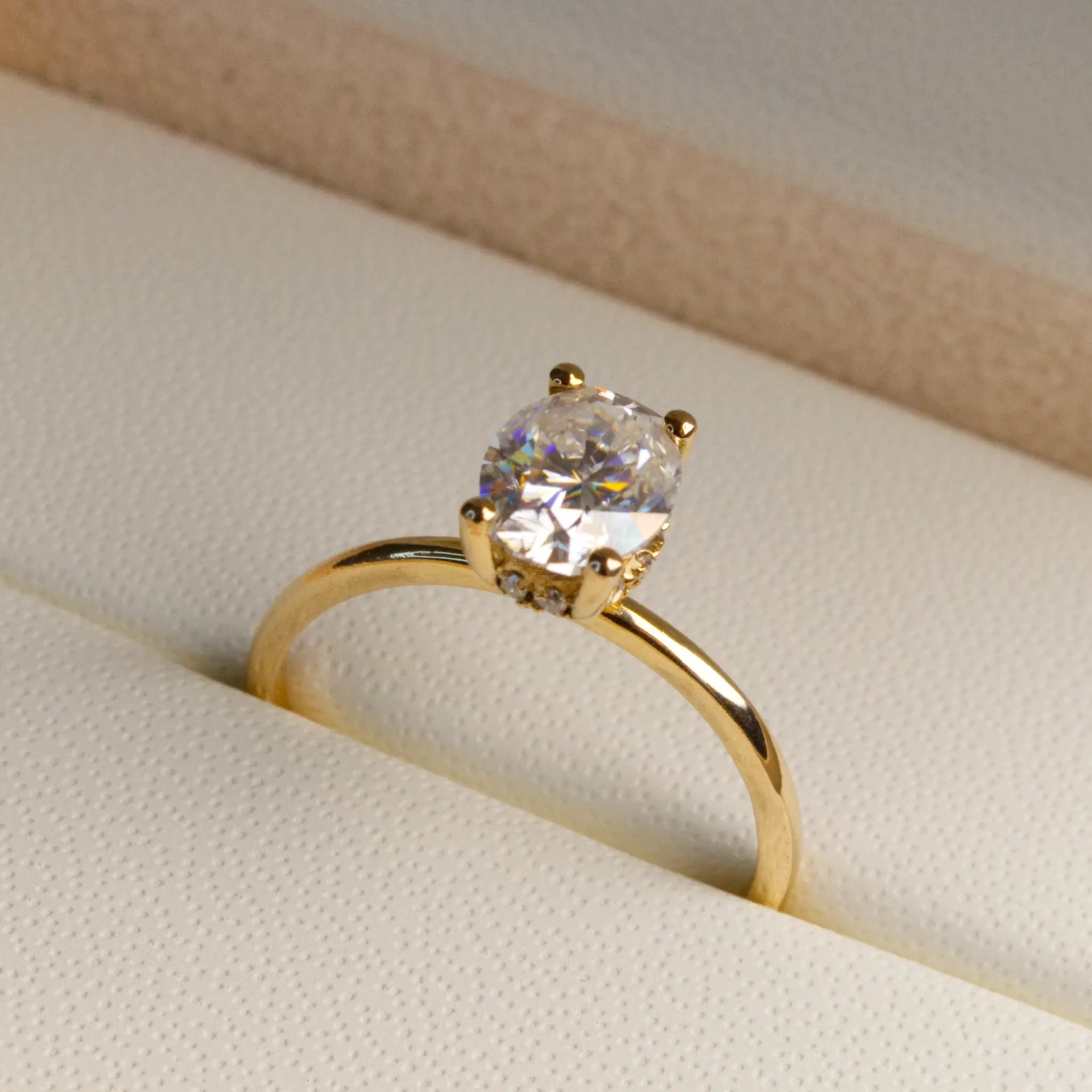 Oval and-Hidden Halo Solitaire Ring