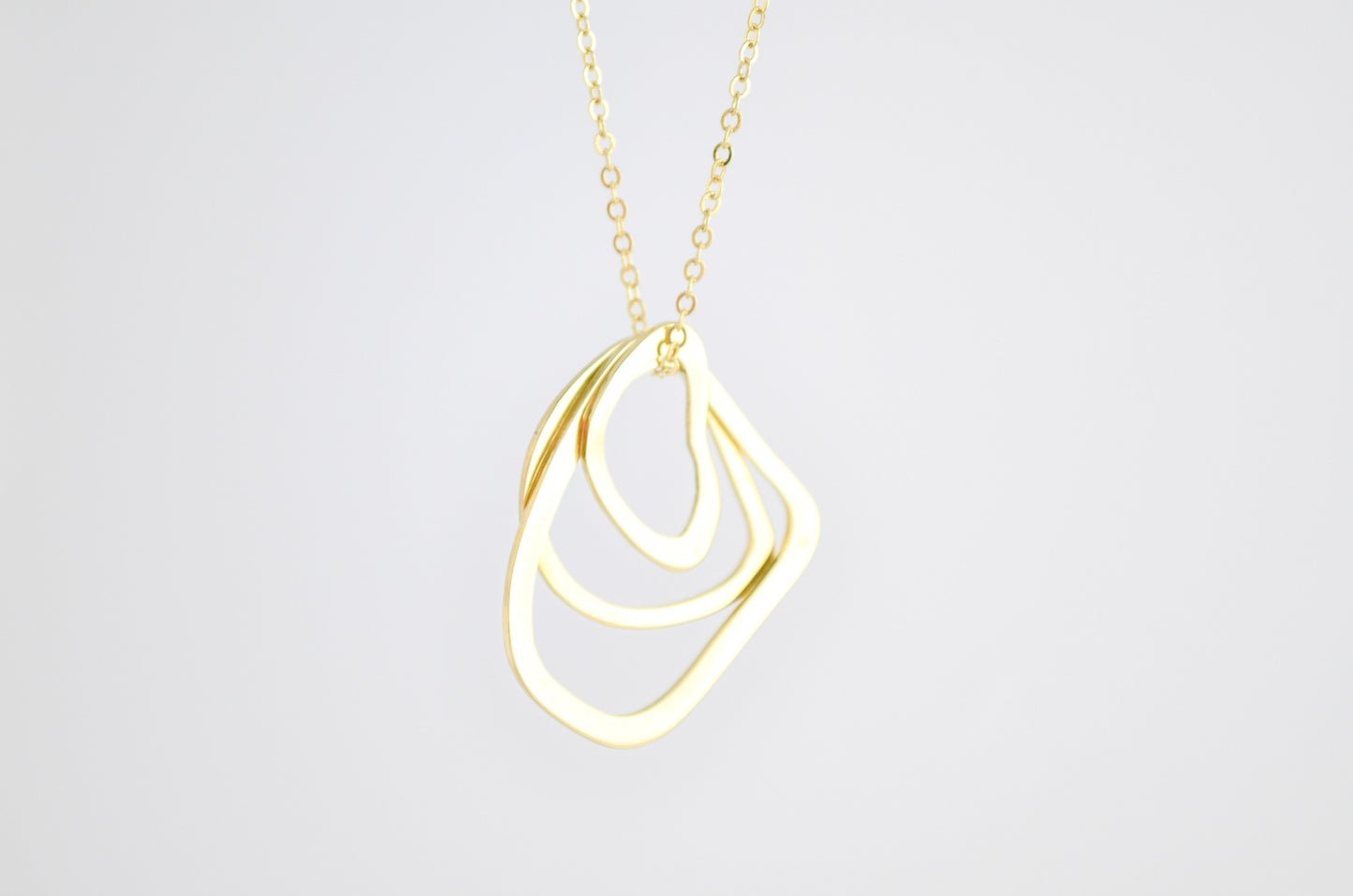Keeva Curve Brass Necklace